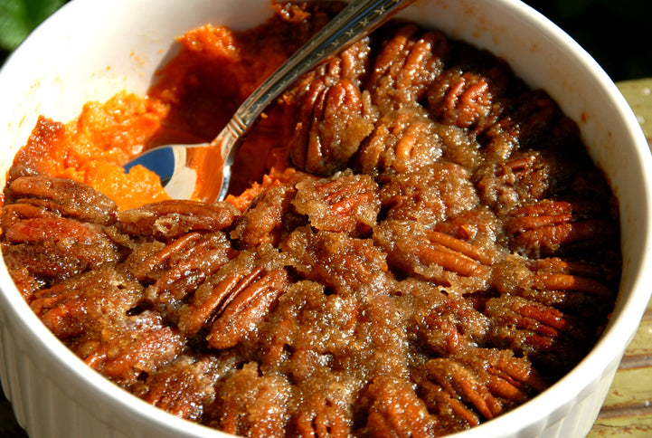 Roasted Sweet Potato Casserole topped with Pecans